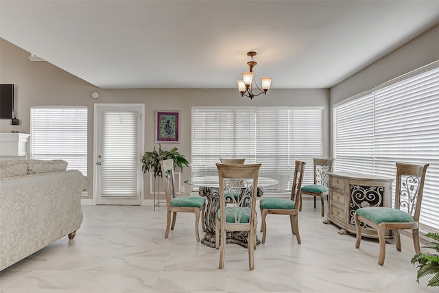 dining space with a chandelier and plenty of natural light