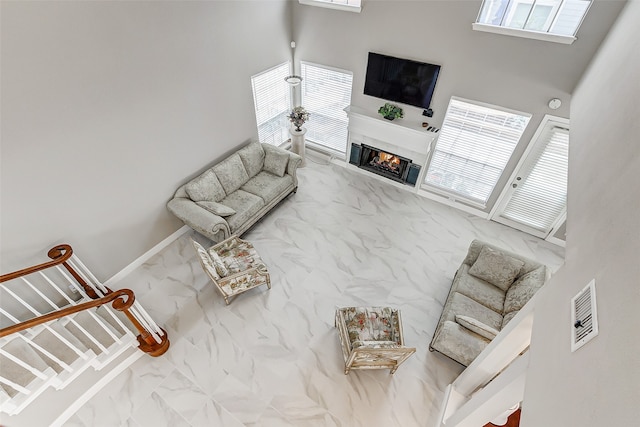 living room featuring a high ceiling