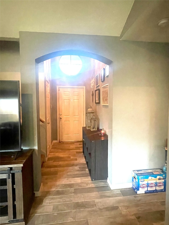 hallway with wood-type flooring