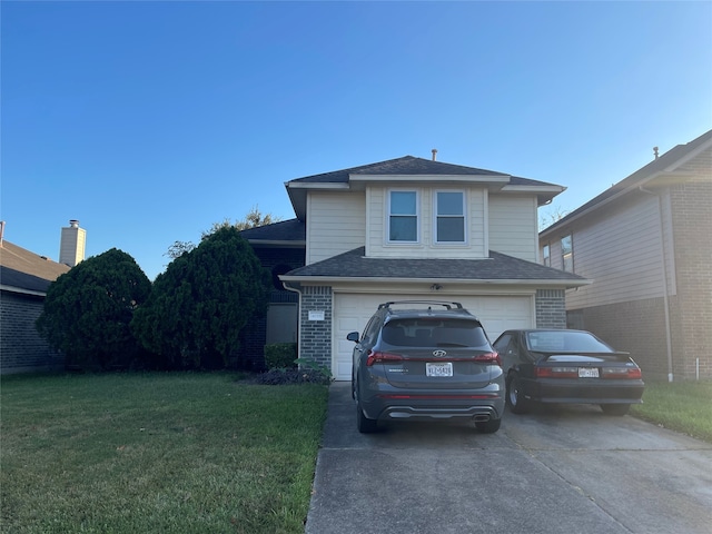 view of front facade featuring a front yard and a garage