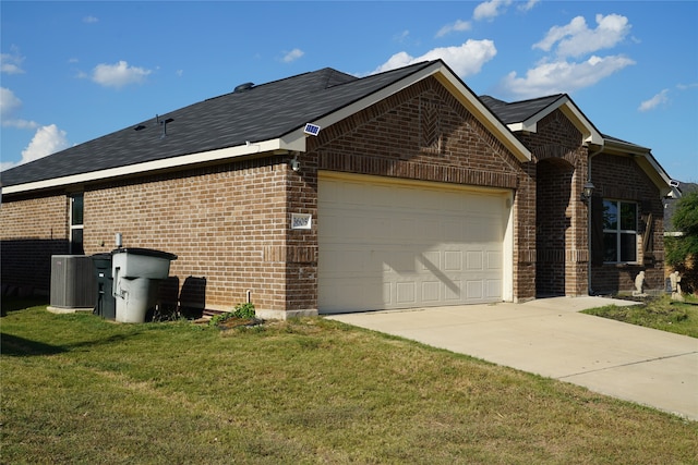 view of property exterior with a yard, a garage, and central AC unit