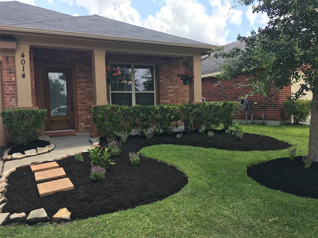 property entrance featuring a yard