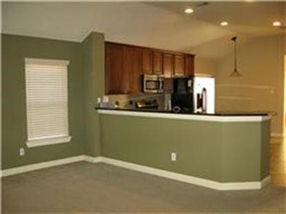 kitchen with appliances with stainless steel finishes and kitchen peninsula