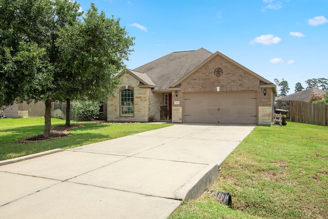 view of front of house featuring a front yard and a garage