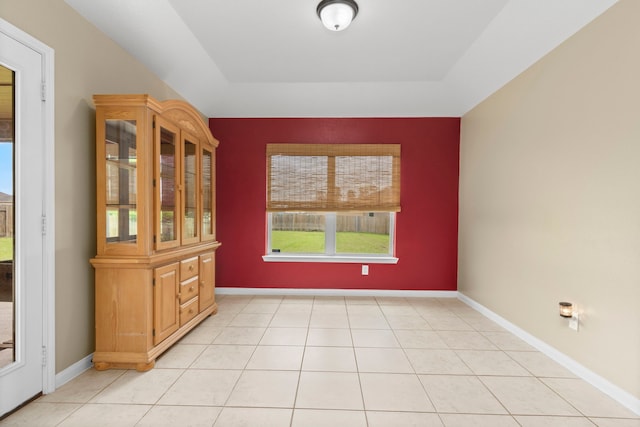 unfurnished dining area with light tile patterned floors