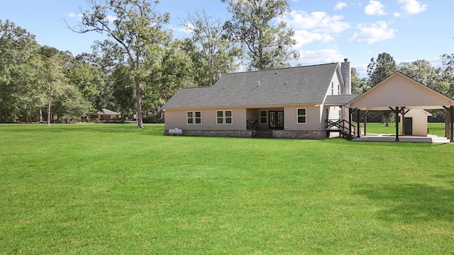 back of house with a gazebo, a patio area, and a lawn