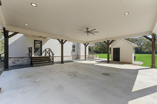 view of patio featuring a shed and ceiling fan