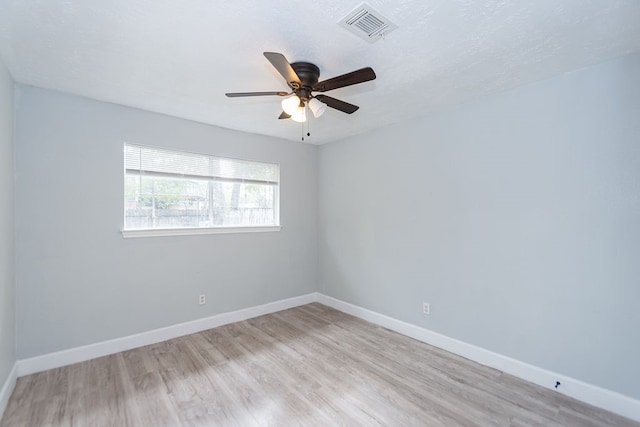 unfurnished room featuring light hardwood / wood-style floors and ceiling fan