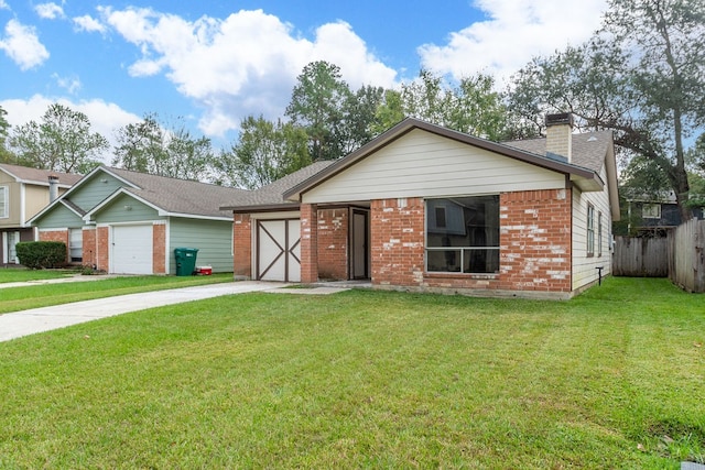 view of front of home with a garage and a front lawn