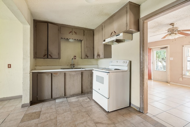 kitchen with sink, light tile patterned flooring, a textured ceiling, electric range, and ceiling fan