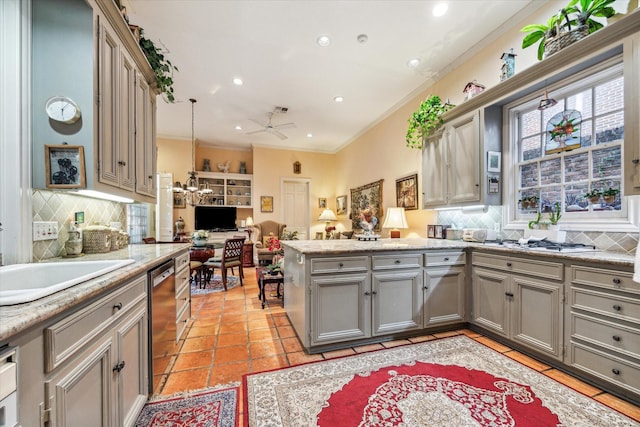 kitchen with a peninsula, open floor plan, ornamental molding, dishwasher, and pendant lighting