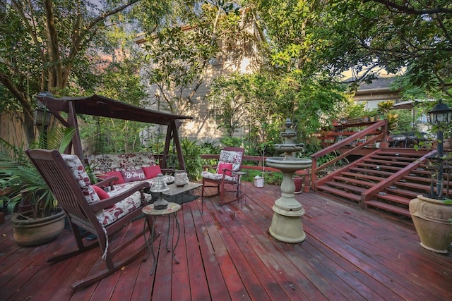 wooden deck featuring fence and an outdoor hangout area