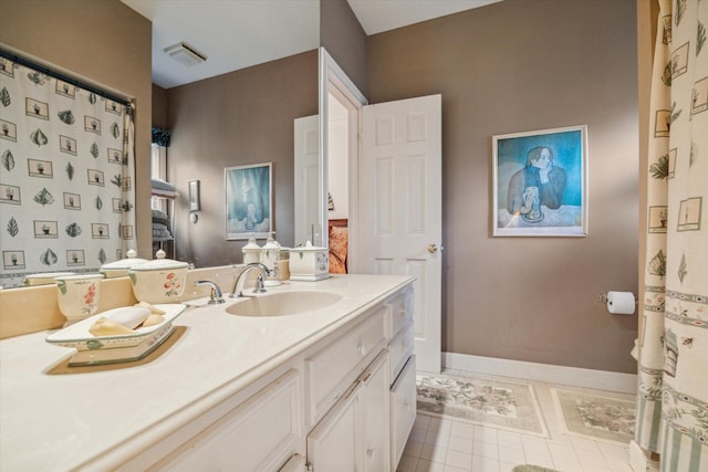 full bath with tile patterned floors, baseboards, and vanity