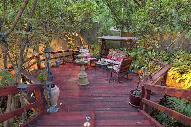 deck featuring fence and an outdoor living space