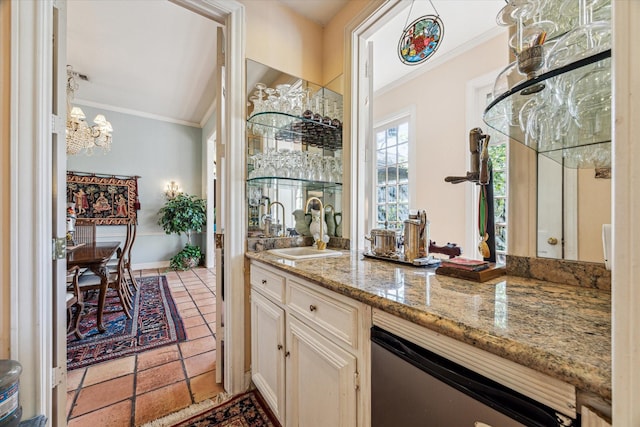 bar with crown molding, dishwasher, and an inviting chandelier