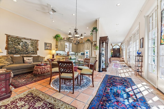 dining space with recessed lighting, a healthy amount of sunlight, crown molding, and light tile patterned floors