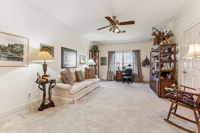 living room featuring light carpet, visible vents, a ceiling fan, and crown molding