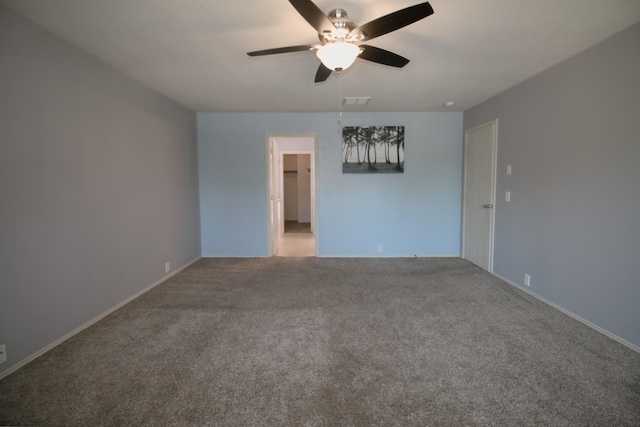 spare room with ceiling fan and carpet flooring