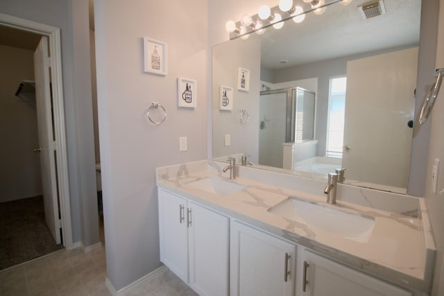 bathroom with vanity and separate shower and tub