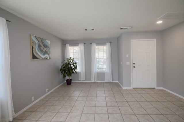 spare room featuring light tile patterned floors