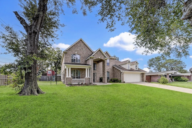 view of front of property featuring a front yard and a garage