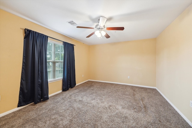 spare room with carpet flooring and ceiling fan