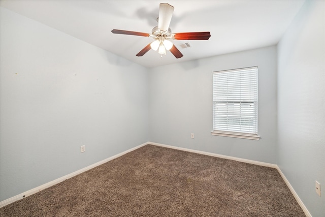 carpeted empty room featuring ceiling fan