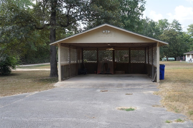 view of vehicle parking featuring a carport