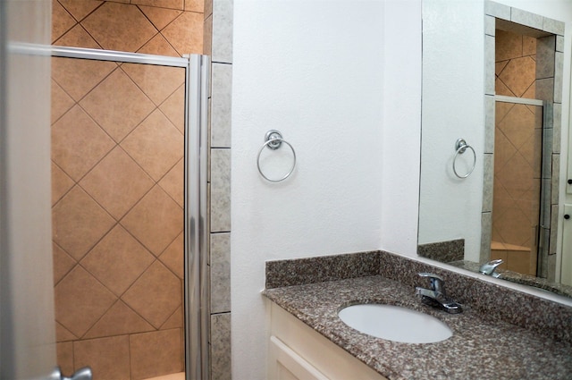 bathroom with vanity and an enclosed shower