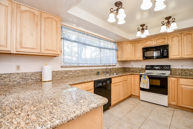 kitchen with light stone countertops, a raised ceiling, sink, black appliances, and light brown cabinets