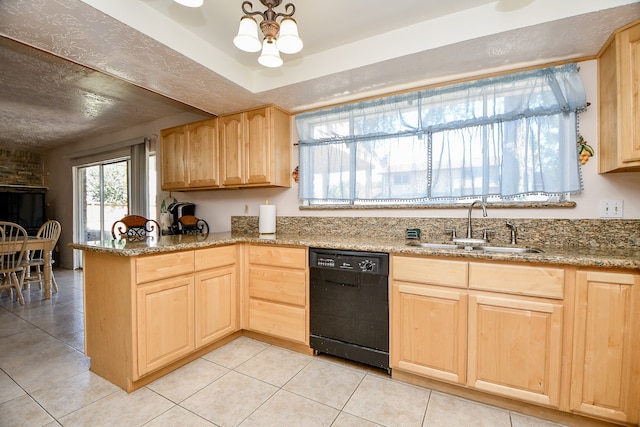 kitchen featuring light brown cabinets, sink, light stone countertops, black dishwasher, and light tile patterned floors