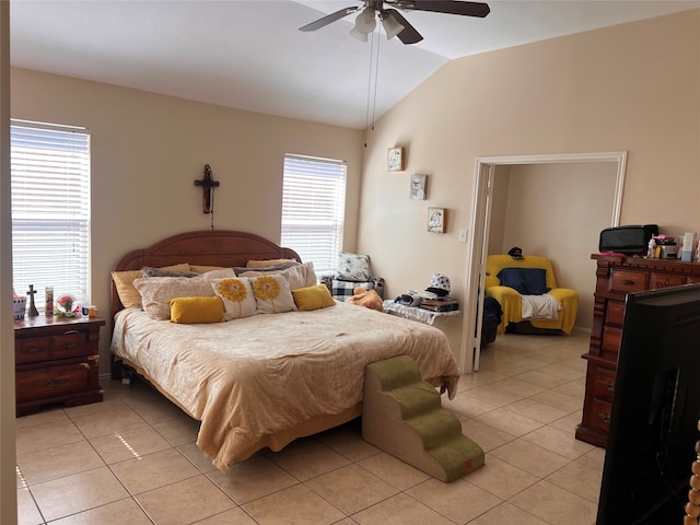 tiled bedroom with lofted ceiling and ceiling fan