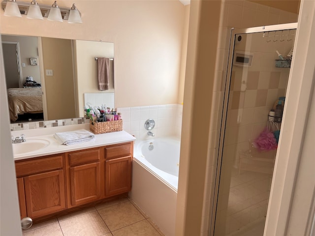 bathroom with vanity, tile patterned floors, and separate shower and tub