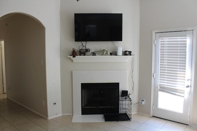 unfurnished living room with light tile patterned flooring