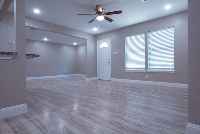 entryway with hardwood / wood-style floors and ceiling fan