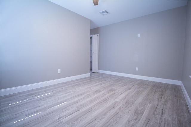 unfurnished room featuring light hardwood / wood-style flooring and ceiling fan