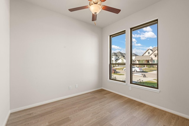 spare room with ceiling fan and light hardwood / wood-style flooring