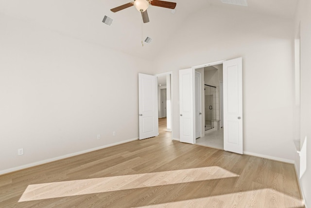 unfurnished bedroom with ceiling fan, high vaulted ceiling, and light wood-type flooring