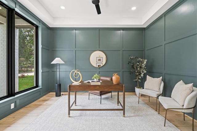 office space featuring light hardwood / wood-style floors and a healthy amount of sunlight