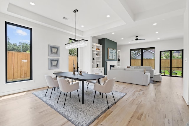 dining space featuring light hardwood / wood-style flooring and ceiling fan