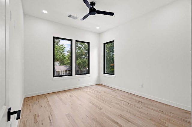 spare room with ceiling fan and light hardwood / wood-style floors