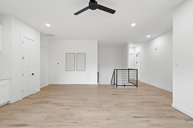 unfurnished room with light hardwood / wood-style flooring and ceiling fan