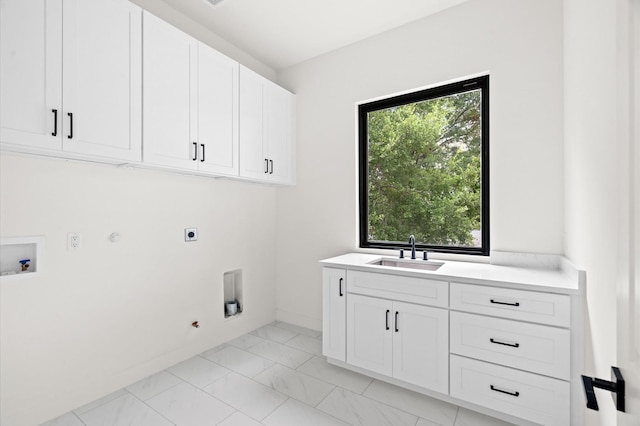 laundry area featuring sink, cabinets, hookup for an electric dryer, hookup for a gas dryer, and hookup for a washing machine