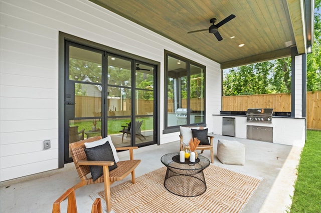 view of patio / terrace featuring area for grilling, ceiling fan, and a grill