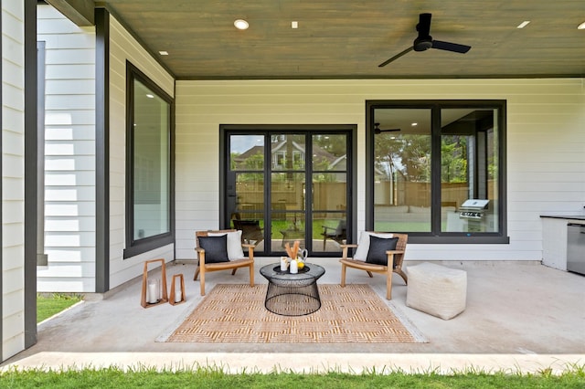 view of patio with area for grilling and ceiling fan