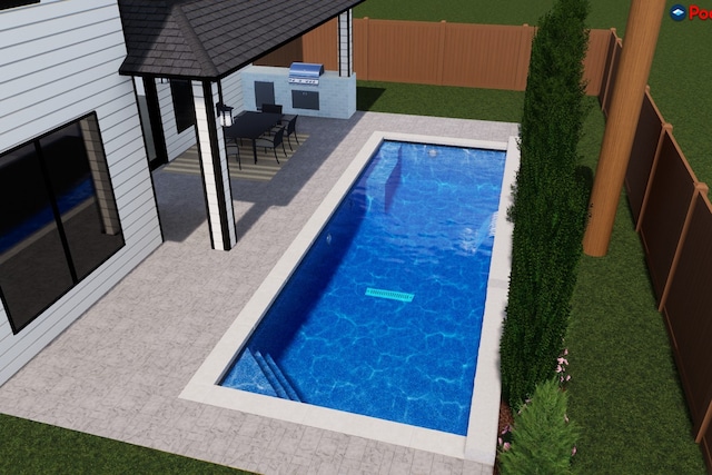 view of pool featuring an outdoor kitchen, area for grilling, and a patio area