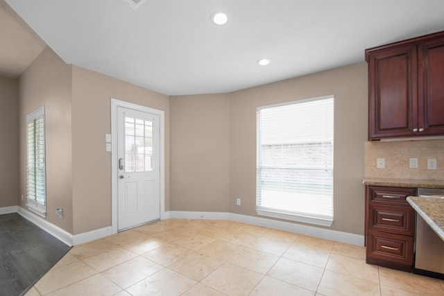 entryway featuring light tile patterned flooring