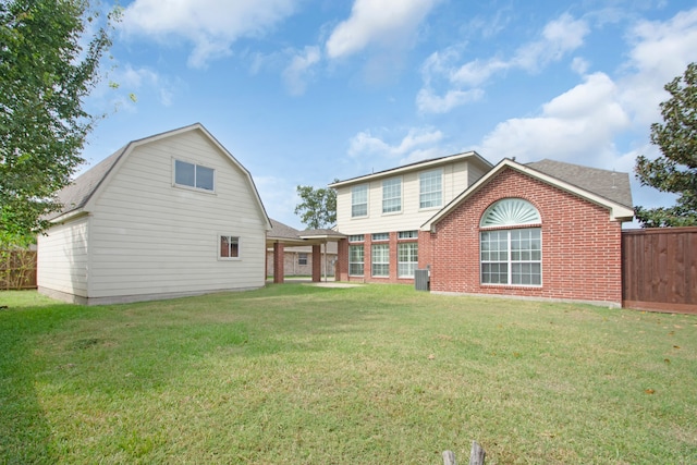 back of house with a yard