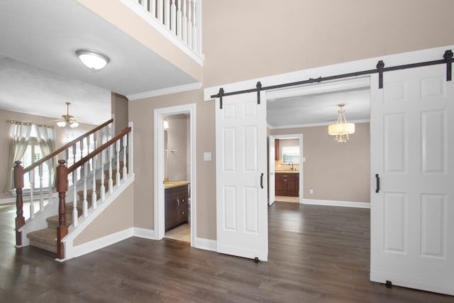 interior space featuring sink, ceiling fan, ornamental molding, and dark hardwood / wood-style flooring