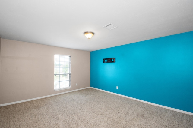 empty room featuring carpet flooring